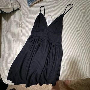 Roxy low cut adorable dress.  Never worn. Size small. Black.